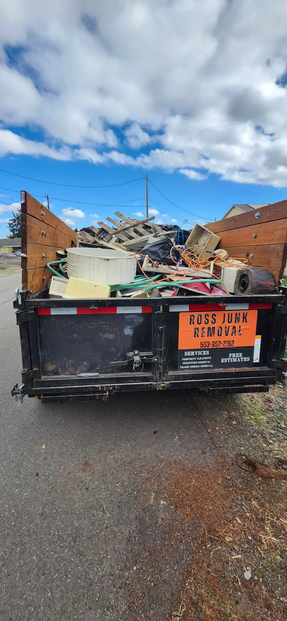 Ross Junk Removal dump trailer loaded with household junk in West Salem, OR