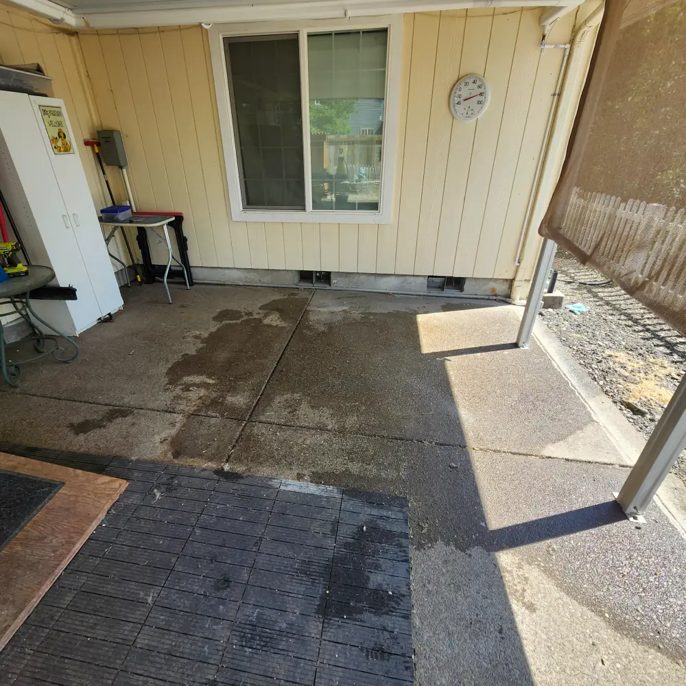 After: the same Keizer patio cleared and swept clean after hot tub haul-away