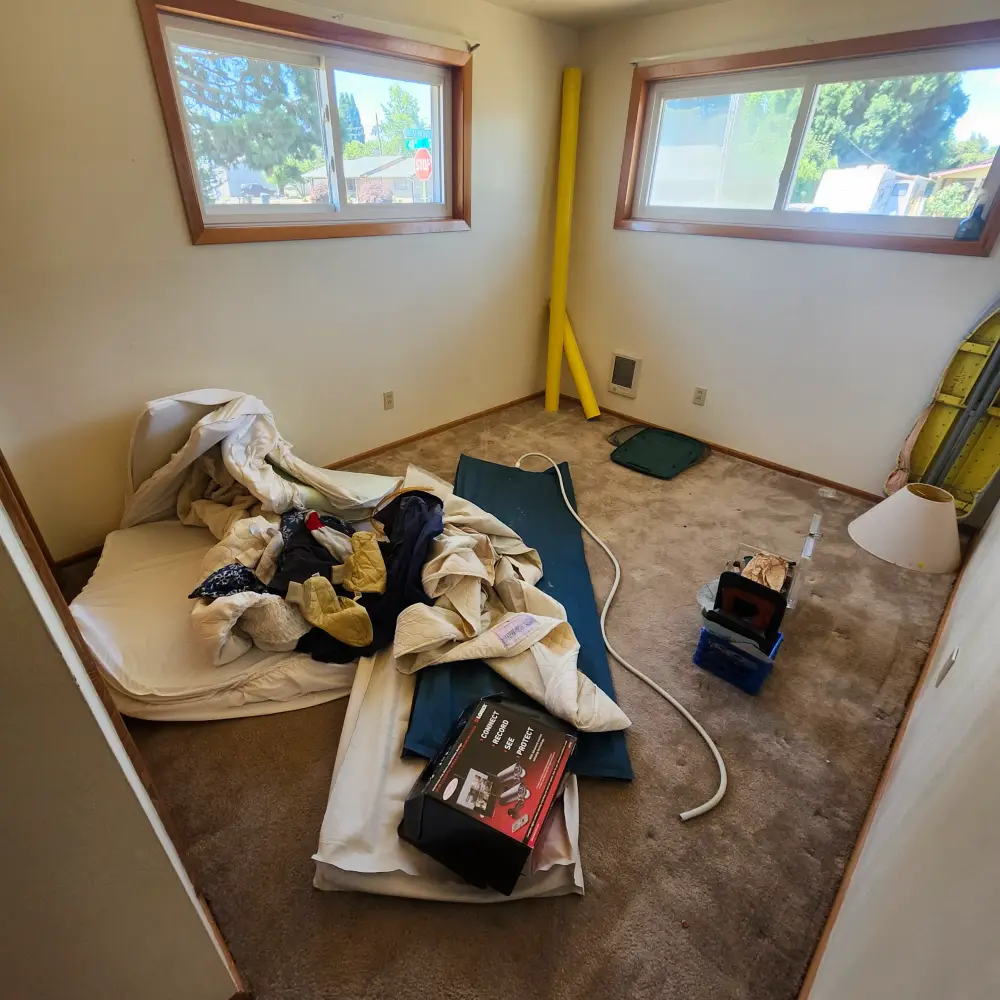 Old mattress and bedding removed from a bedroom during a West Salem home cleanout