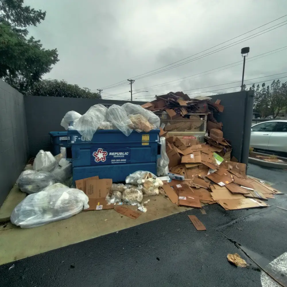 Before: an overflowing commercial dumpster enclosure in West Salem, OR