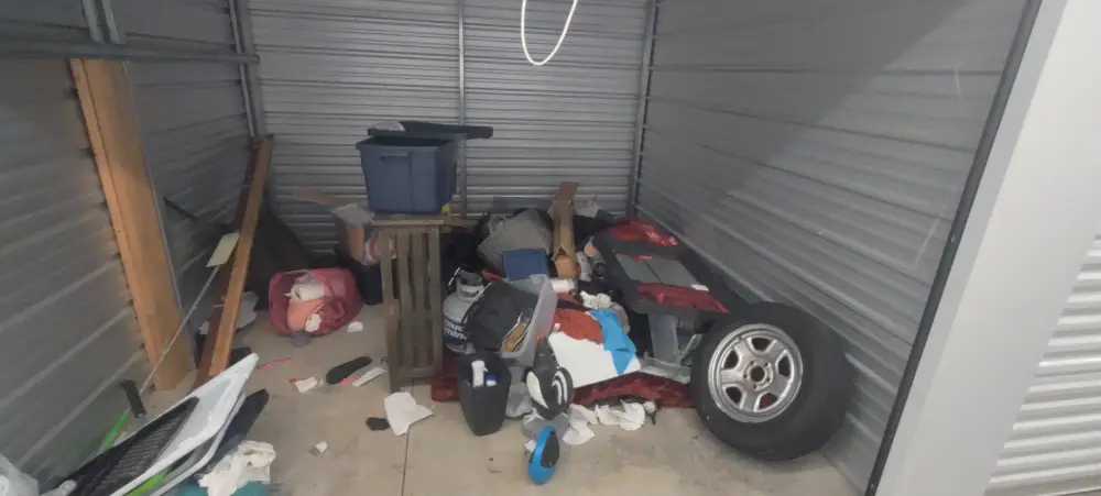 Storage unit cleared of junk and an old tire during a commercial cleanout near Salem, OR