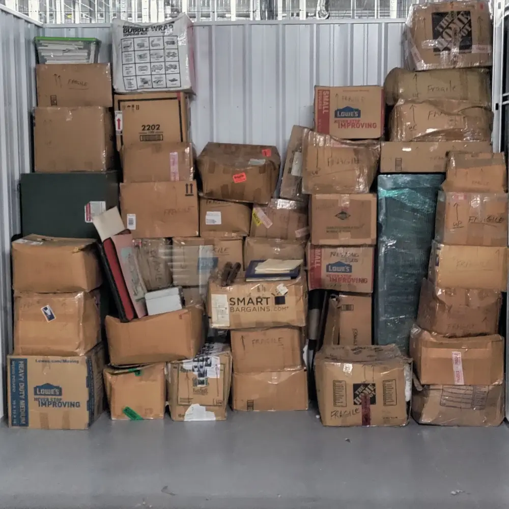 Storage unit packed with moving boxes cleared out in Keizer, OR