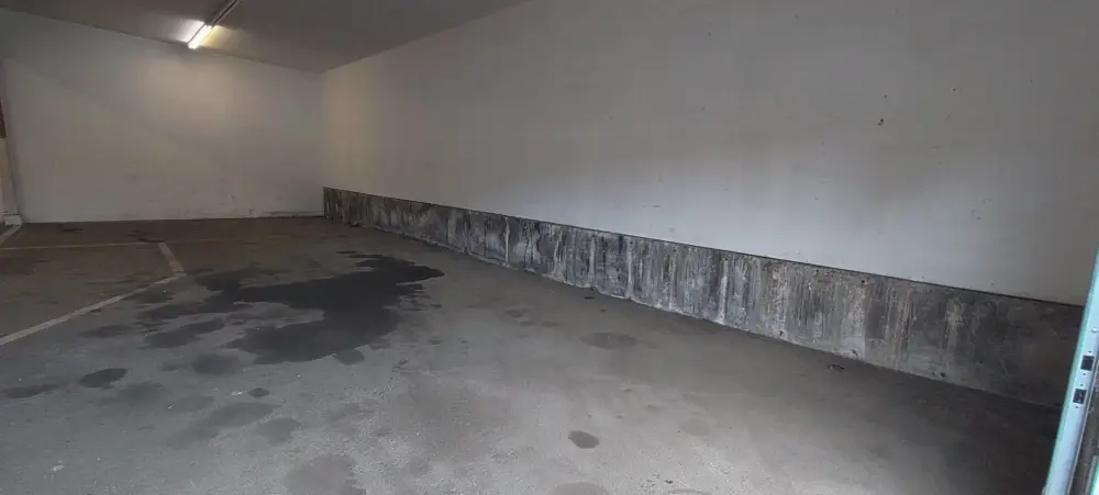 After: the empty, swept commercial floor following a Salem cleanout