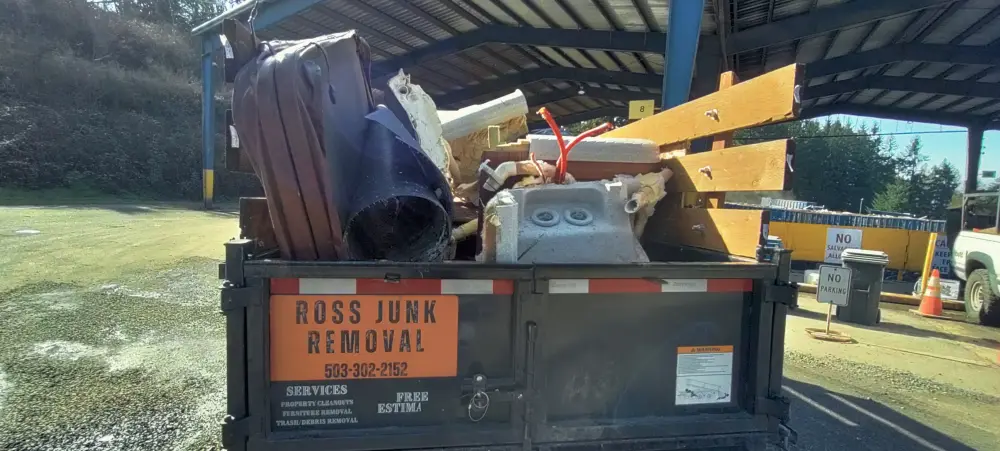 Ross Junk Removal trailer unloading responsibly after a Doaks Ferry pickup run