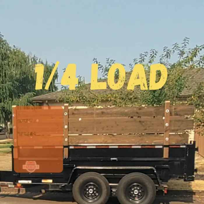 Ross Junk Removal dump trailer filled to a quarter load